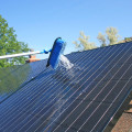 What type of cleaning cloth should be used on solar panels?